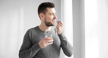a man takes drugs to treat prostatitis