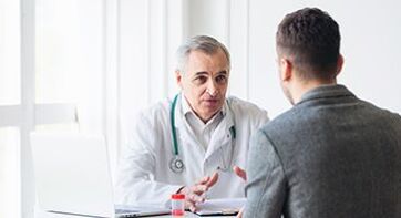 man at a specialist appointment